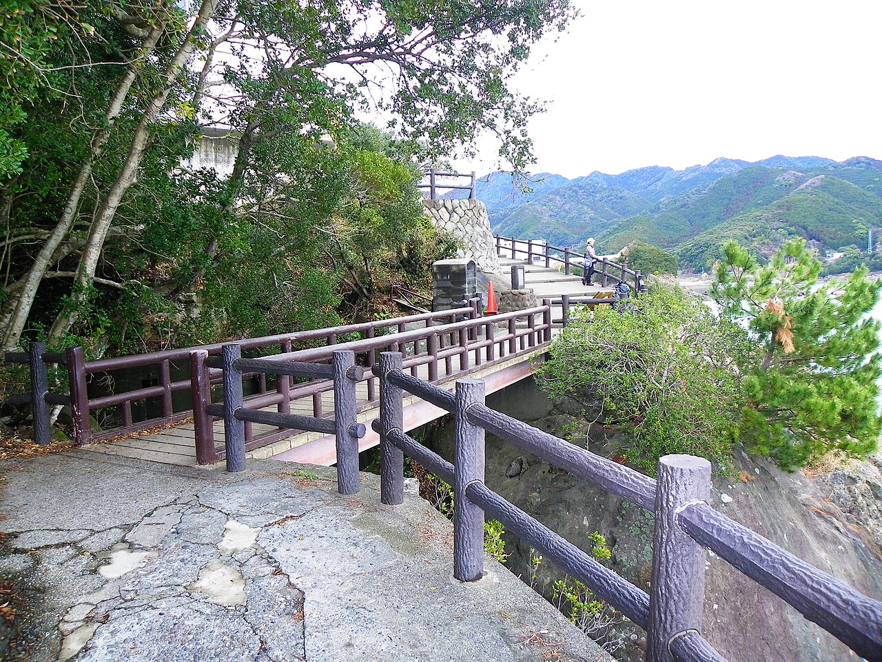 Cliff walkway trail with steel railings running along Onigajo