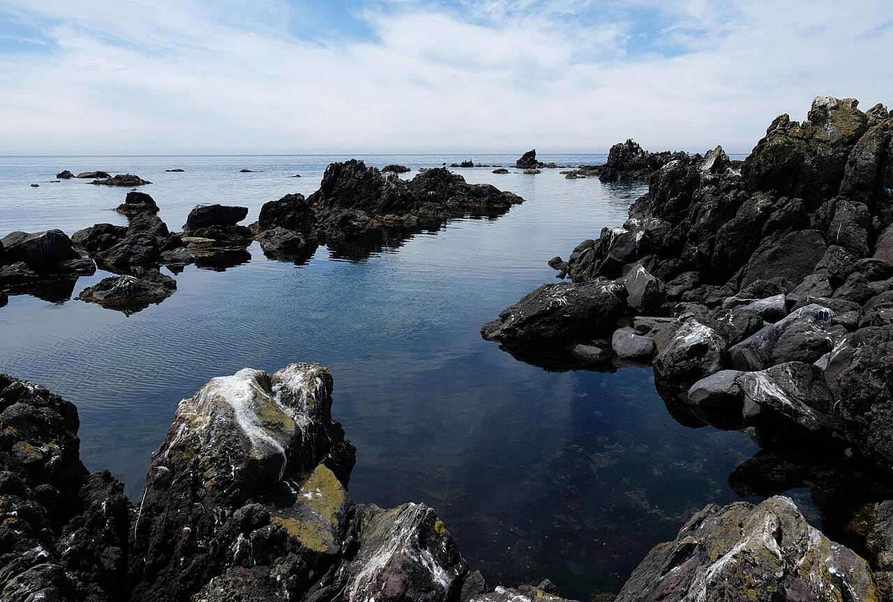 Lava rocks at Senhoshi Misaki Park Rishiri Island with the Sea of Japan behind