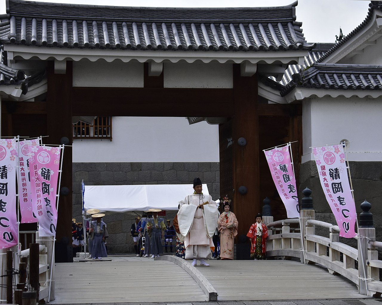 Shizuoka Matsuri parade with cherry blossoms overhead