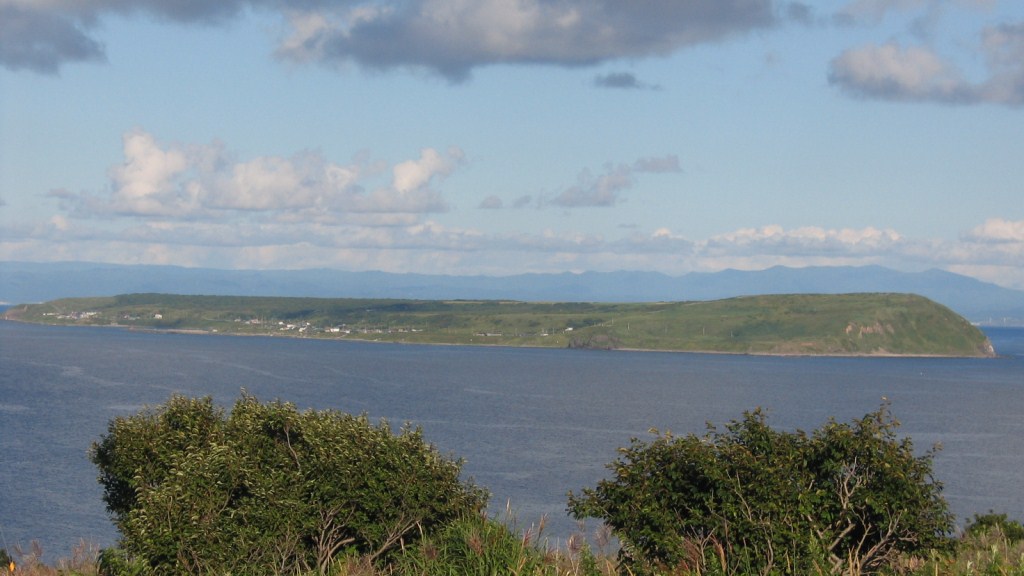 Yagishiri Island view showing the sheep pastures and central forest